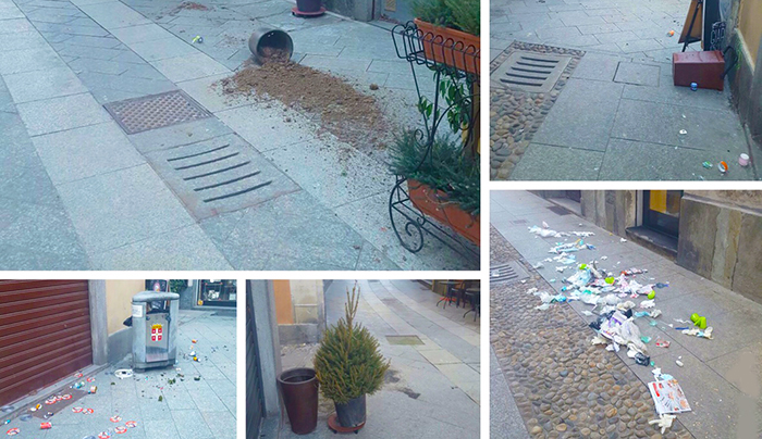 Umgestürzte Pflanzenbehälter, ausgeleerte Abfallbehälter, nächtlicher Vandalismus im Zentrum von Domodossola